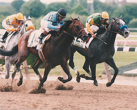 Chris McCarron (outside) winning with Touch Gold the 1997 Belmont Stakes (Gr.1). Photo Thoroughbredmemories